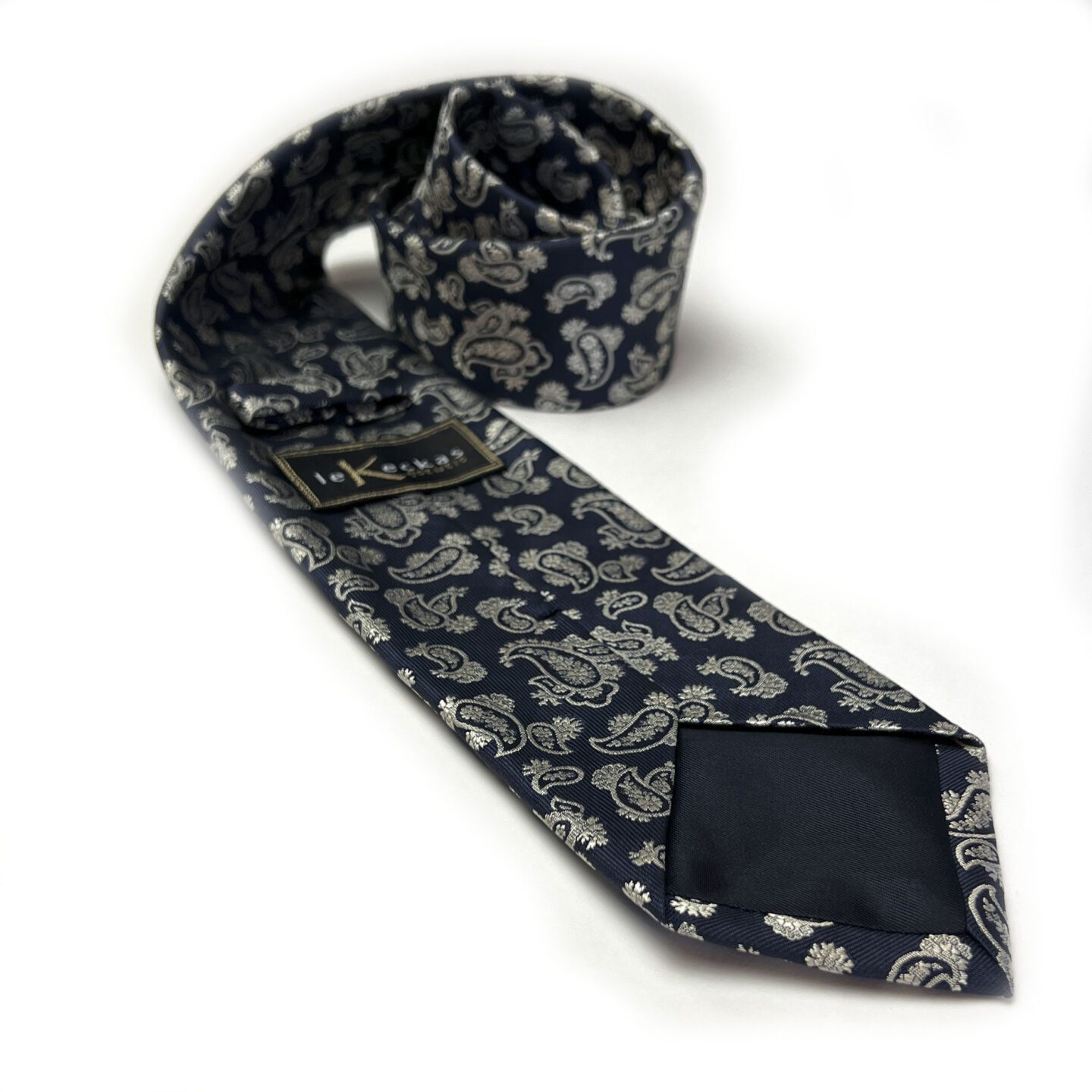 Tamsiai mėlynas vyriškas kaklaraištis puoštas kreminiu "paisley" raštu